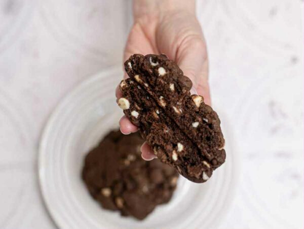 Inside view of a Triple Chocolate New York Cookie from Morton Baking Academy – thick, gooey, and packed with dark, milk and white chocolate chips.