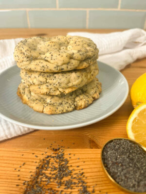 Stack of lemon and poppyseed cookies with lemon and poppy seeds