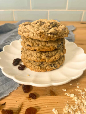 Stack of chewy oatmeal raisin cookies with oats and raisins